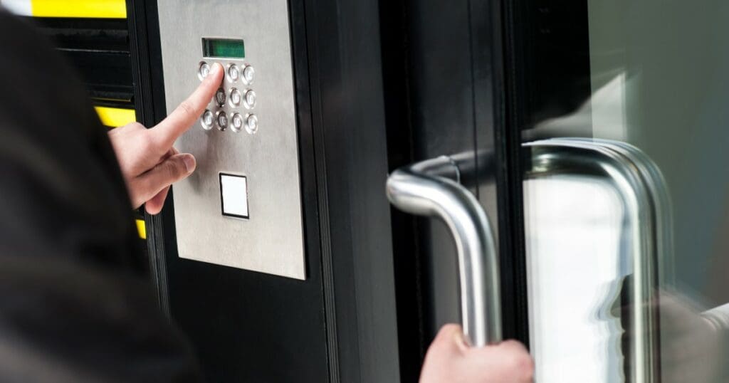 man opening a door with a key code