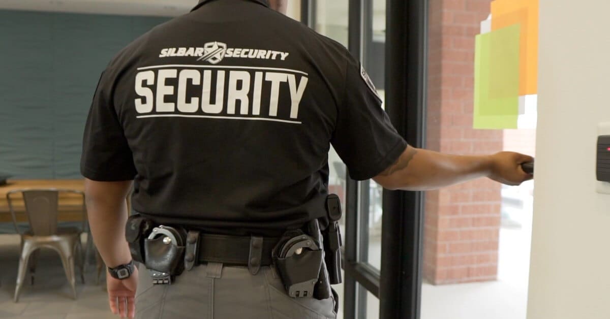 silbar security guard opening a door