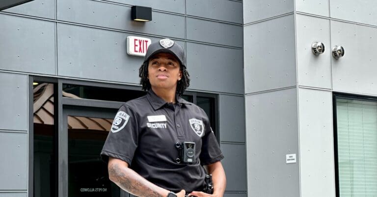 silbar security guard standing in front of a building