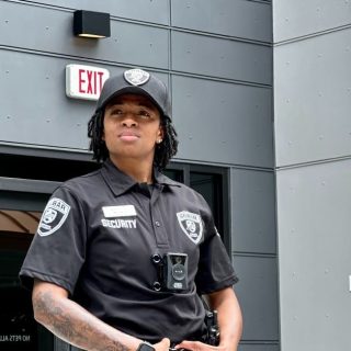 silbar security guard standing in front of a building